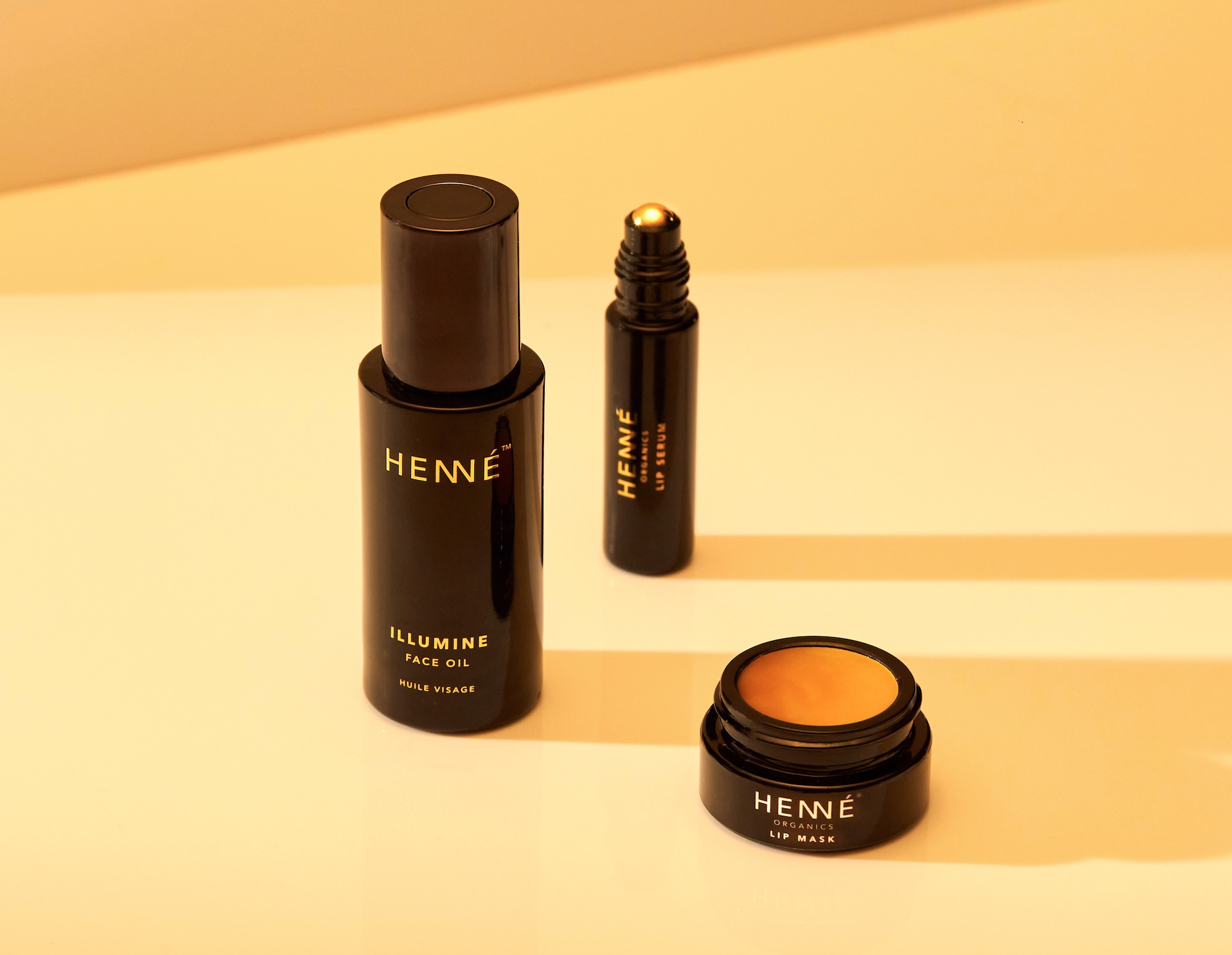 face oil bottle, lip serum bottle, and open lip mask jar