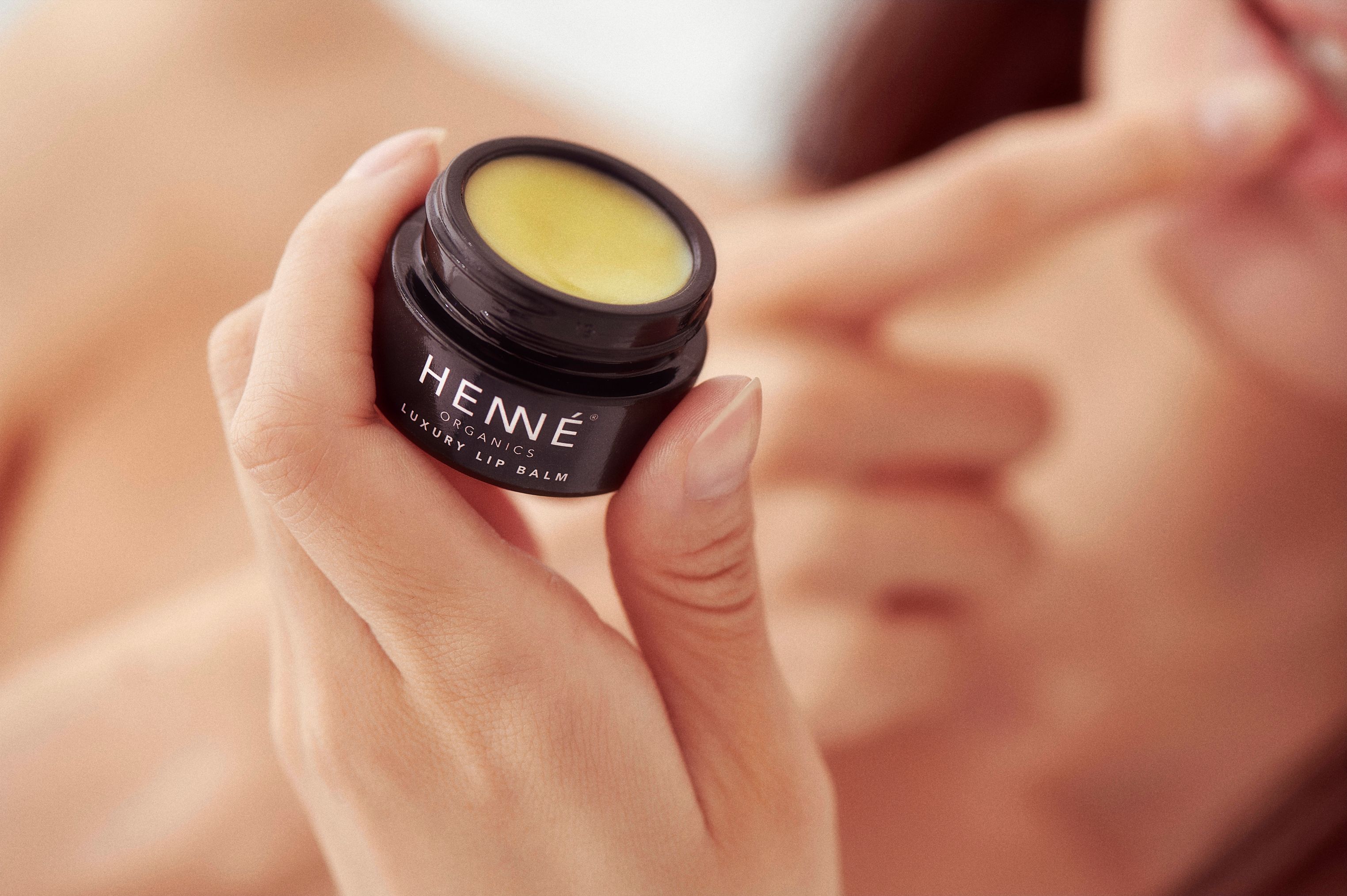 hand holding a lip balm