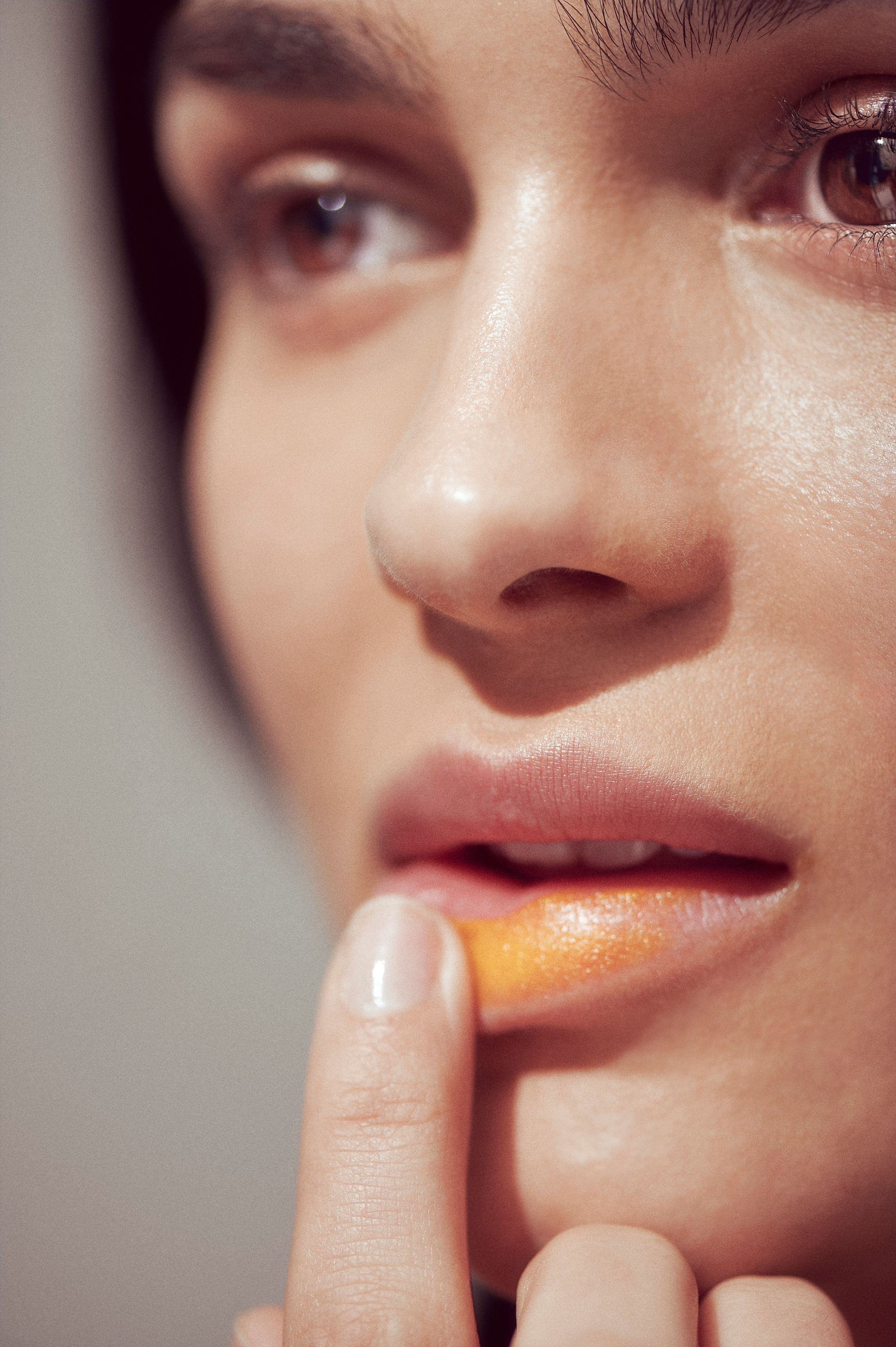 woman applying lip mask